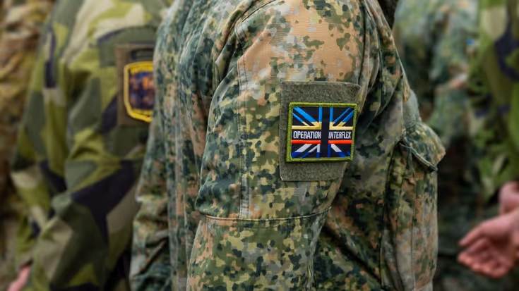 Logo van een missie op de schouder van een militair.