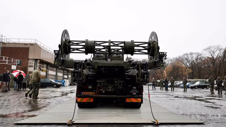 Systeem voor wegenmattenlegger.